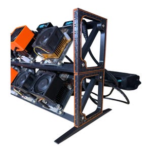 May include: A black and orange computer component rack with multiple fans and circuit boards. The rack has a decorative frame with orange accents and is designed to hold several components. The fans are black and the circuit boards have various components.