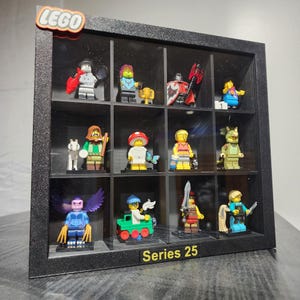 May include: A black display case with 12 clear compartments, each holding a different LEGO minifigure from Series 25. The case has a black background and a gold label that reads "Series 25".