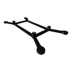 May include: A black, 3D-printed bracket with a rectangular center and four extended arms. Each arm has a circular end with a hole. The bracket also features four brass-colored threaded inserts.