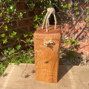 Tall, heavy oak doorstop