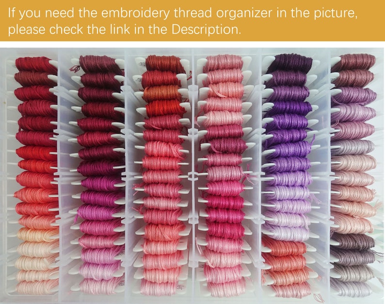 May include: A clear plastic organizer filled with rows of colorful embroidery floss. The floss is organized by color, with shades of red, pink, purple, and brown.