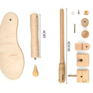 May include: Wooden embroidery hoop stand kit with a 18 inch hoop, 30.5 inch stand, and all the necessary hardware to assemble the stand. The kit includes a wooden base, a wooden rod, and a wooden hoop.