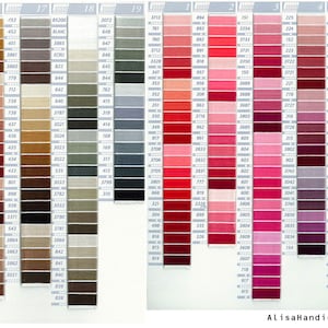 May include: A color chart of DMC embroidery floss with numbered spools of thread in various shades of red, pink, purple, blue, gray, brown, and beige. The chart is labeled with numbers 1 through 5 and 16 through 19.