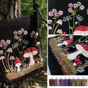 May include: A black crossbody bag featuring detailed embroidery of red and white mushrooms, pink wildflowers, and green stems. The design includes a small snail near the base. A color palette of eleven embroidery thread shades is displayed below.