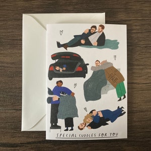 May include: A greetings card with illustrations of people cuddling in different situations. The card has the text "SPECIAL CUDDLES FOR YOU" and comes with a white envelope. The illustrations are in a cartoon style.