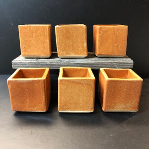 Square sake cups with orange shino glaze