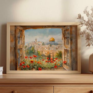 May include: Watercolor painting of a cityscape framed by a wooden window. The artwork depicts a view of a city with a golden-domed structure, red flowers, and lush greenery. The painting is displayed in a light-colored wooden frame.