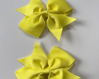 Neon yellow l hair bow pair/ 4 inch bow on a single prong clip