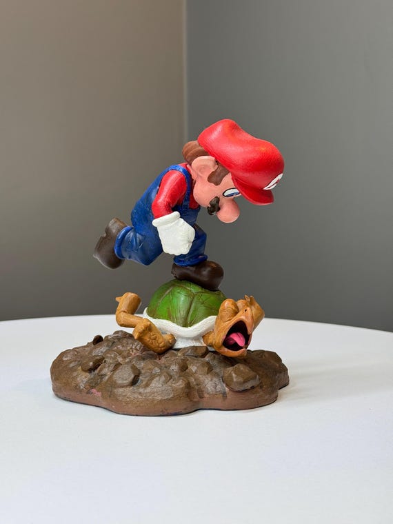 Hand-painted resin Mario statue with real artistic craft behind it — not a factory figure, not a printout, an actual painter's interpretation of a Nintendo icon.