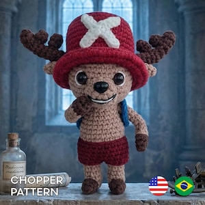 May include: A crocheted plush toy of a cartoon character, wearing a red hat with a white cross, brown antlers, and red shorts. The toy has a smiling face and a small blue backpack. The text "CHOPPER PATTERN" is visible.