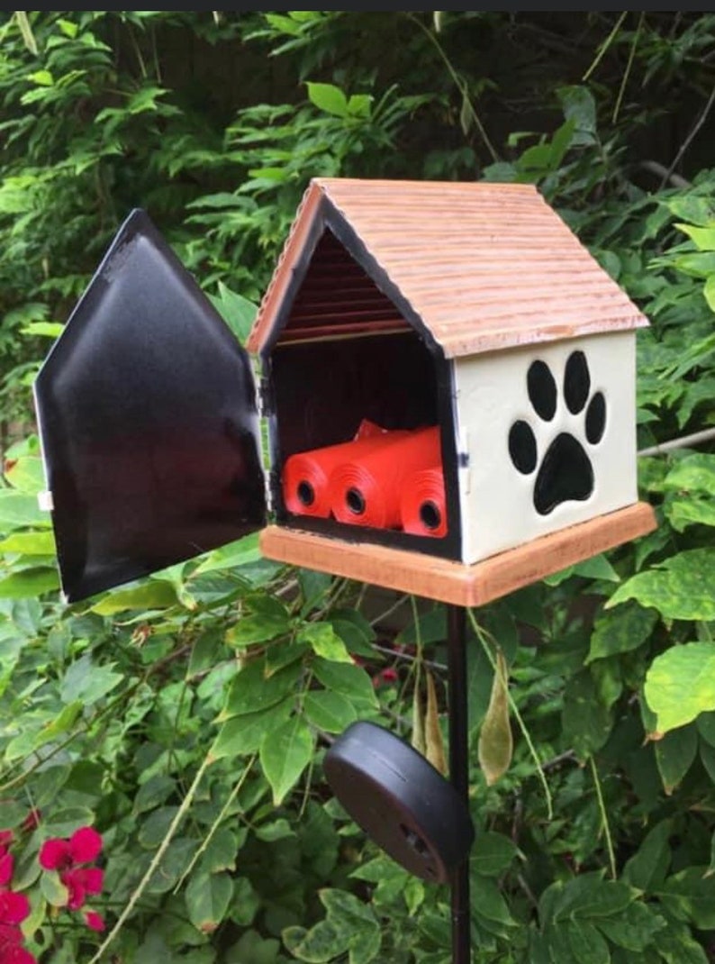 The Helping Paw Dog Bag Dispenser is a decorative dispenser. Etsy