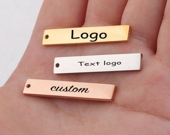 Aangepaste bedel strip tag aangepaste sieraden Gepersonaliseerde bedel roestvrij staal lasergegraveerd logo bedel kralen voor het maken van sieraden kw1911r