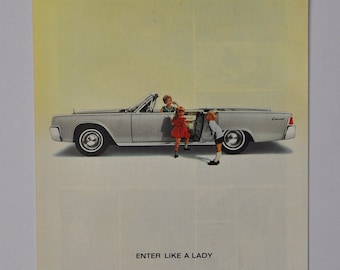 May include: A silver Lincoln Continental convertible with four doors is parked on a white background. Three children are getting into the car. The text "ENTER LIKE A LADY" is printed below the car. The text "LINCOLN CONTINENTAL" is printed at the bottom of the image.