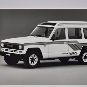 Foto 1987 Nissan Patrol Wagon Super Roof Turbo Diesel (macchina fotografica foto auto azienda vendita brochure stampa auto giapponese jeep)