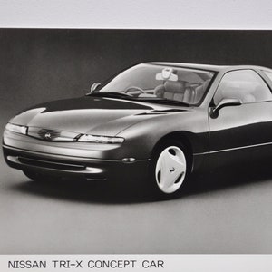Foto 1992 Nissan TRI-X Concept Car (autopers foto foto motor dealer dealer verkoop brochure print poster oud Japans prototype)