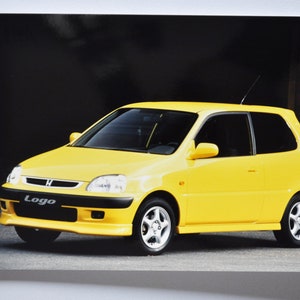 Foto 1999 Logo von Motorradfahrern (Autopresse Fotografie Bild Autohaus Luxus Händler Broschüre Verkaufsposter Druck japanisch auto gelb)