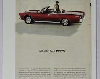 May include: A red Lincoln Continental convertible with four doors is parked on a white surface. The car has a black top and a man in a black uniform is standing next to the car. The text "Count the Doors" is printed in black at the top of the image. The text "Lincoln Continental" is printed in black at the bottom of the image.