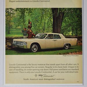 May include: A vintage advertisement for the Lincoln Continental car. The ad features a beige car with a family of three standing on the bonnet. The text reads "Elegant understatement is a Lincoln Continental." and "Lincoln Continental is the luxury motorcar that stands apart from all other cars. It distinguishes you among fine car owners. Singular in its classic look. Unique in its ease of handling, its centre-opening rear doors. Full power auxiliaries are standard equipment. There is only one Lincoln Continental. A car for your individual taste. Lincoln Continental. North America's most distinguished motorcar."