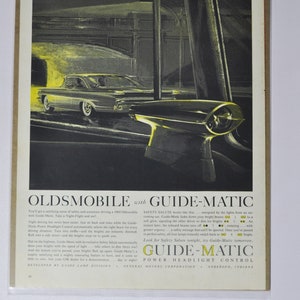 Grande pubblicità per auto Oldsmobile del 1960 con controllo dei fari elettrici Guide-Matic (stampa di vecchie foto pubblicitarie classiche GM General Motors)