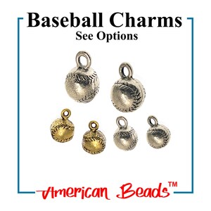 May include: Baseball charms in silver and gold tones. The charms are small, round, and detailed to resemble baseballs, with visible stitching. The image includes the text "Baseball Charms" and "See Options" at the top, and "American Beads" at the bottom.