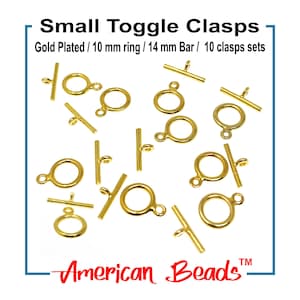 May include: Gold-plated small toggle clasps. The set includes 10 clasps with 10 mm rings and 14 mm bars. The image shows the clasps scattered on a white background. The text "Small Toggle Clasps" and "American Beads" are visible.