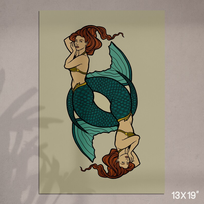May include: A vertical print featuring two mermaids in a mirrored design. The mermaids have red hair, teal fishtails, and are wearing gold-colored tops. The print is 13 x 19 inches.