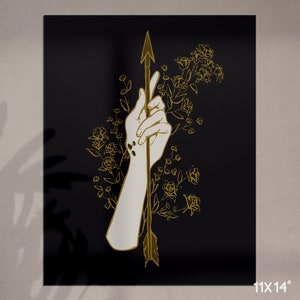 May include: A hand holding an arrow with a gold outline, surrounded by gold flowers on a black background.