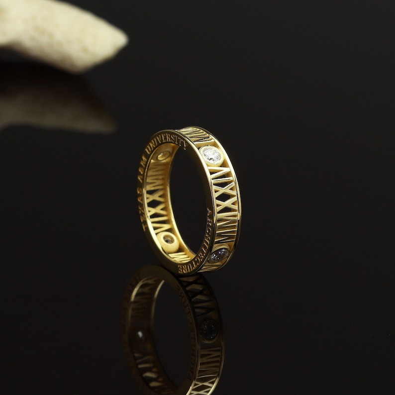 14k gold roman numeral graduation ring with sparkling gemstones