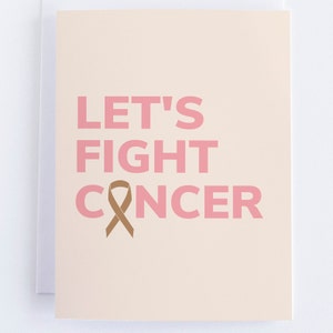 May include: A greeting card with the message "LET'S FIGHT CANCER" in pink letters. A brown ribbon symbol is featured below the words "FIGHT" and "CANCER" on a light beige background.