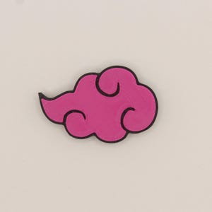 May include: A pink cloud with a black outline. The cloud has a swirl design.