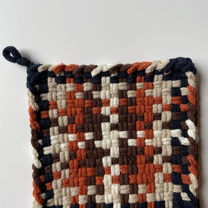 Dark navy, flax, spice, chocolate, winter white potholder