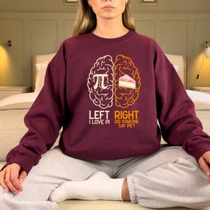 May include: A maroon sweatshirt with a graphic of a brain divided into two halves. The left side says "Left I Love Pi" and the right side says "Right Did Someone Say Pie?"