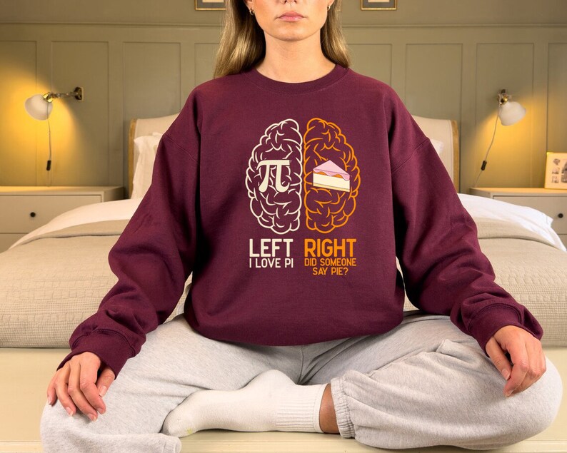 May include: A maroon sweatshirt with a graphic of a brain divided into two halves. The left side says "Left I Love Pi" and the right side says "Right Did Someone Say Pie?"