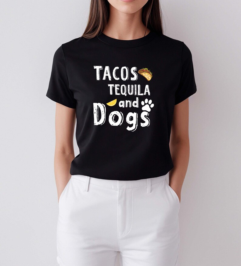 May include: Black t-shirt with white text that reads "Tacos Tequila and Dogs" with a taco and paw print graphic.
