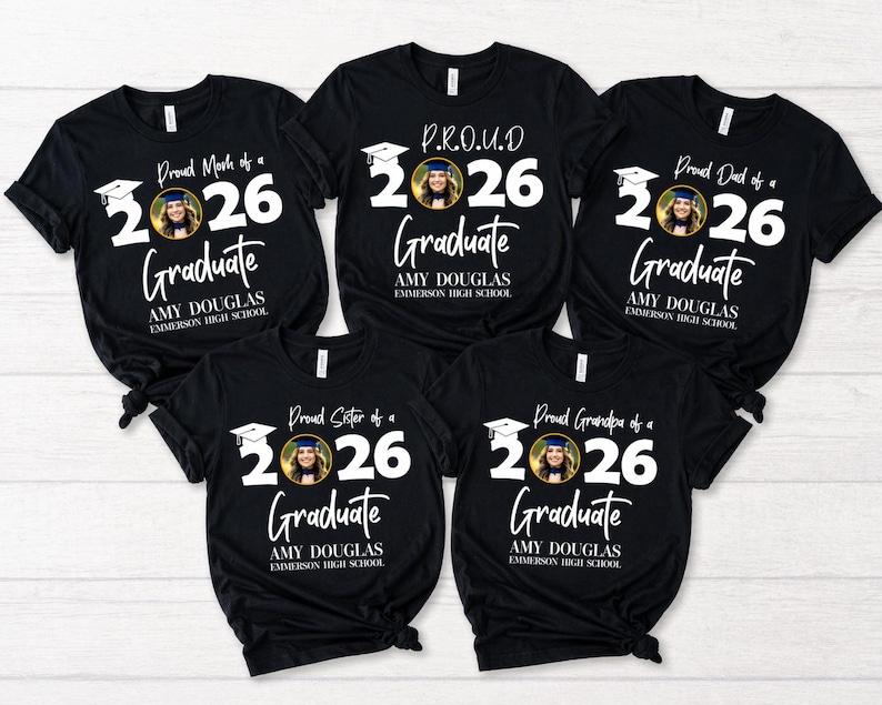 May include: Black t-shirts with white text and a photo of a graduate. The shirts read "Proud Mom of a 2026 Graduate," "P.R.O.U.D 2026 Graduate," "Proud Dad of a 2026 Graduate," "Proud Sister of a 2026 Graduate," and "Proud Grandpa of a 2026 Graduate."