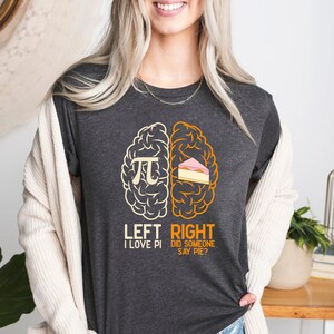 May include: A dark gray t-shirt with a graphic of a brain divided into two halves. The left side says "Left I Love Pi" and the right side says "Right Did Someone Say Pie?"