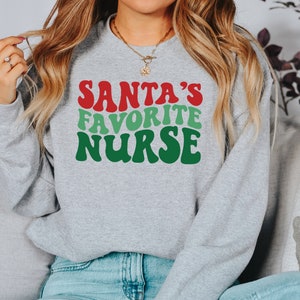 Santa Favorite Nurse, Christmas nurse tee, holiday nurse shirt, Nurse Shirt, Nurse Holiday Gift, Cute Santa Shirt, Retro Santa Shirt image 3