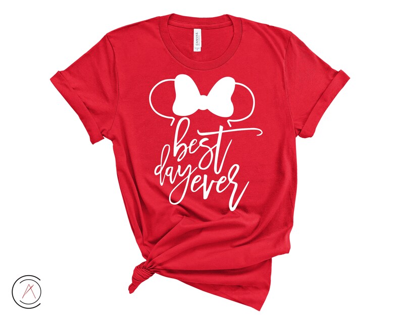 May include: Red t-shirt with a white bow and the text "best day ever" in white.