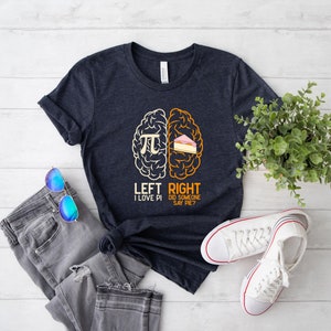 May include: A dark blue t-shirt with a graphic of a brain divided into two sections. The left side says "Left I Love Pi" and the right side says "Right Did Someone Say Pie?"