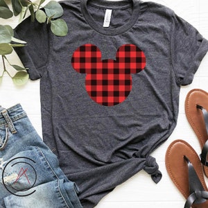 May include: A dark grey t-shirt with a red and black checked Mickey Mouse head design.