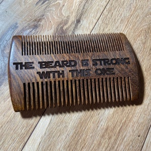 May include: A wooden beard comb with the text "THE BEARD IS STRONG WITH THIS ONE" engraved on it.