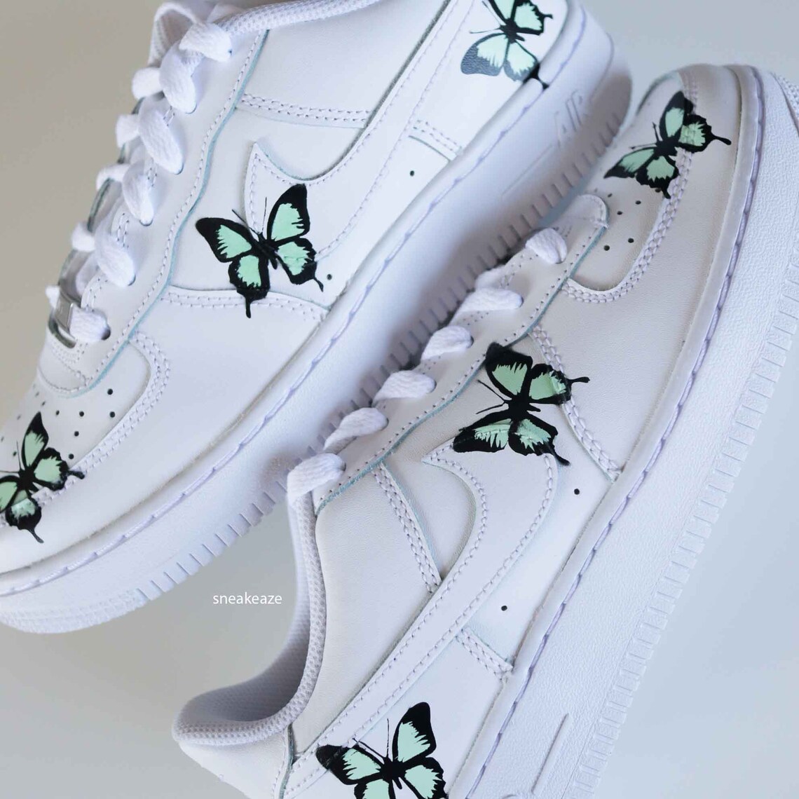 white air force ones with butterflies