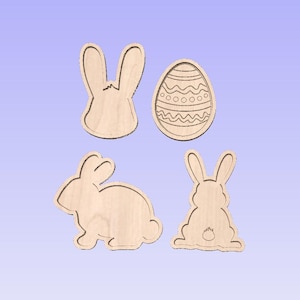 May include: Four unfinished wooden cutouts of Easter-themed shapes: a bunny rabbit, an egg, and two bunny rabbits. The shapes are ready to be painted or decorated.