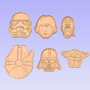May include: Set of six wooden cutouts featuring characters from Star Wars. The characters include Darth Vader, Yoda, Chewbacca, Luke Skywalker, a Stormtrooper, and the Millennium Falcon.