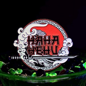 HaHaHeHu SUBTRONICS hat pin og full glow in the dark. Comes with matching sticker and secret wrist slinger