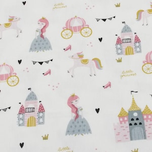 May include: White fabric with a repeating pattern of castles, princesses, carriages, and unicorns in pink, gold, and gray. The words "little princess" are written in gold. Black hearts and flags complete the design.