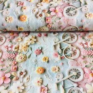 May include: A fabric with a repeating pattern of embossed flowers and bicycles in pastel colors. The design features pink, yellow, and white flowers, along with white bicycles. The background has a soft blue and pink gradient.