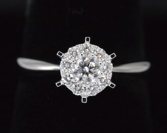 White gold solitaire ring with diamonds.