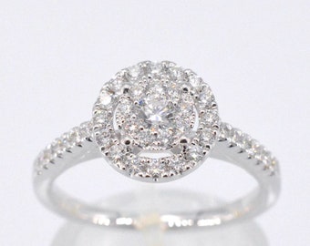 Entourage ring with brilliant cut diamond.
