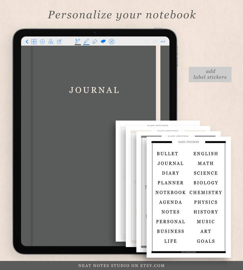 May include: A digital tablet with a grey screen displaying the word "JOURNAL" in white text. The tablet is on a white background. A stack of printable label stickers with various categories, such as "Bullet Journal", "English", "Maths", "Diary", "Science", "Planner", "Biology", "Notebook", "Chemistry", "Agenda", "Physics", "Notes", "History", "Personal", "Music", "Business", "Art", "Life", and "Goals" are shown to the right of the tablet.